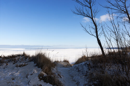 Frozen Baltic Sea coastline in winter at R�gen Sellin under blue sky