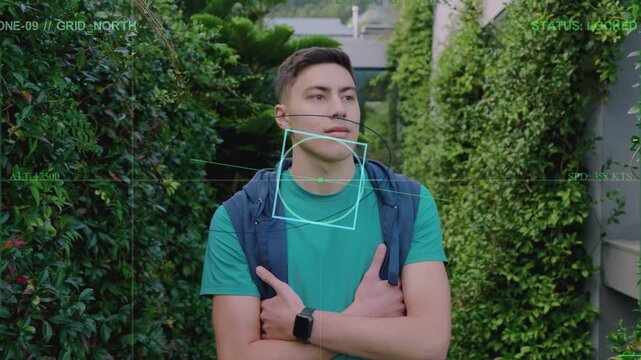 Reacting to HUD overlay, adult man wearing teal t-shirt shifting gaze in hedge walkway, backpack