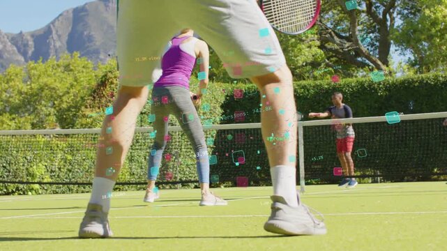 Foreground legs bracing while partner stepping as ball nearing net, sports AR tags marking zones