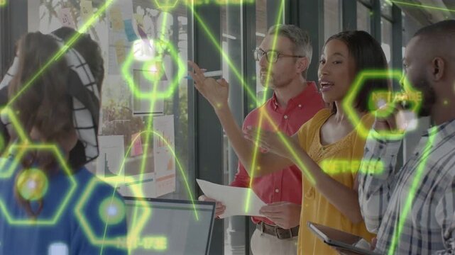 Blue team lead pointing at charts, team aligning business goals, neon overlays animating over glass