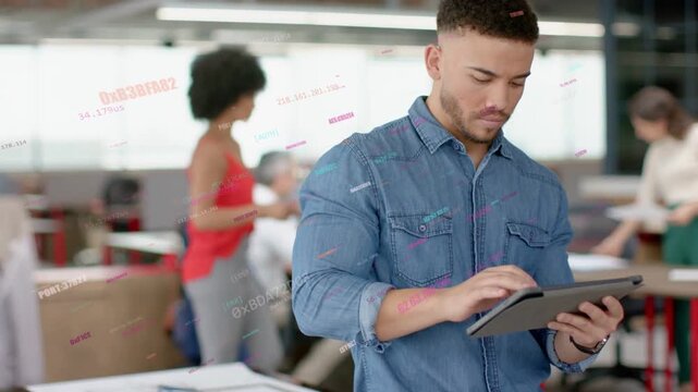 Man in business office tapping tablet while live charts rising and highlighting papers for review