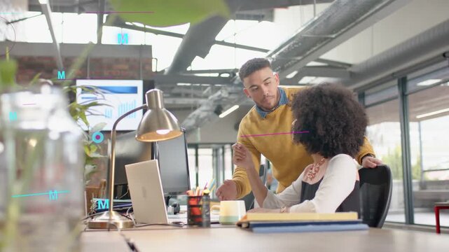 Team reviewing finance data as magenta$ overlay fading triggers man leaning woman pointing laptop