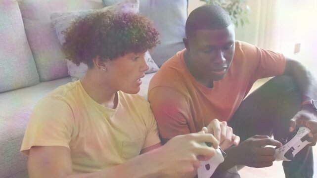 Two players sitting couch with controllers left tapping buttons activating gaming HUD guiding moves