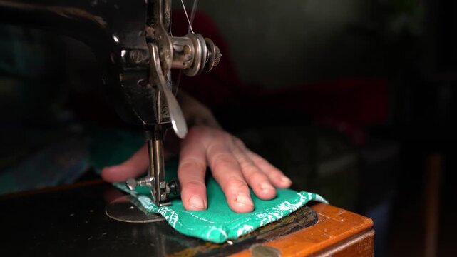 Old sewing machine in use at home, sewing on a vintage machine