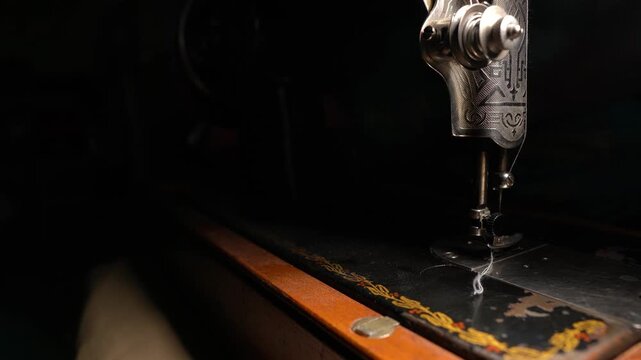 Old sewing machine in use, sewing on a vintage machine