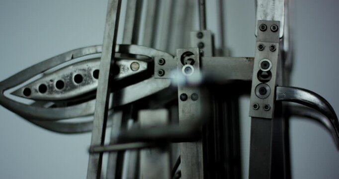 Detailed view of complex industrial metal mechanical components and levers in a factory