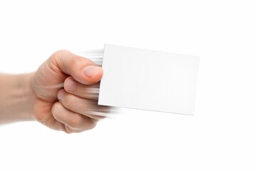 Obraz premium A hand holds a blank white business card with a dynamic motion blur effect. This image represents speed, efficiency, and professional networking. Ideal for corporate branding and marketing.