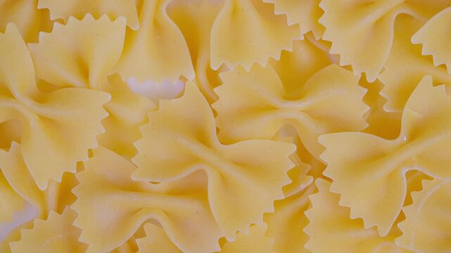 Uncooked pasta with ornate surface. Raw pasta with elaborate design and ornate surface detailing. Uncooked pasta with complex pattern and richly textured surface characteristics
