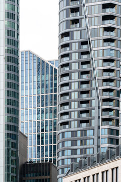 Skyscraper architecture detail in urban city skyline with modern facade windows rising vertical against the sky for an abstract metropolitan view
