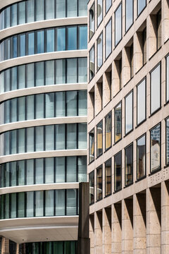 Glass architecture detail on modern facade where curve windows and geometry pattern shape an urban abstract study of contemporary office design