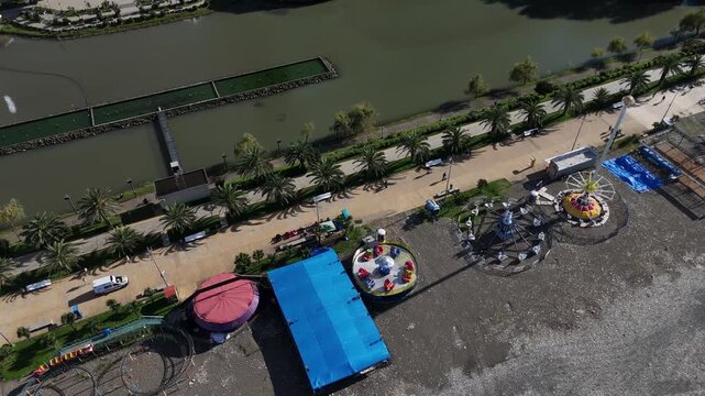 Aerial shot of the park area and lake along the waterfront boulevard in Batumi, Georgia.