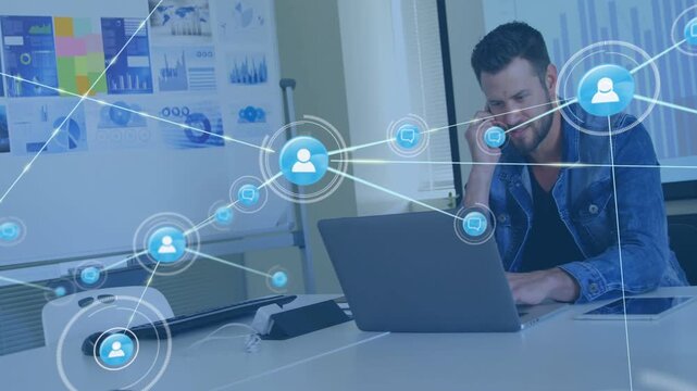 Man holding phone typing laptop, network icon appearing then layering over desk showing tech links