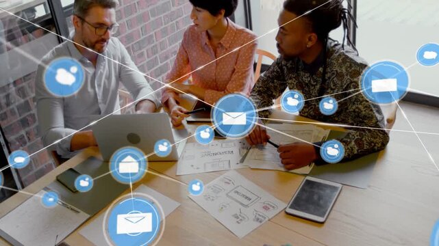 Business team leaning at table while mail icon appearing, growing icon overlay spreading, planning