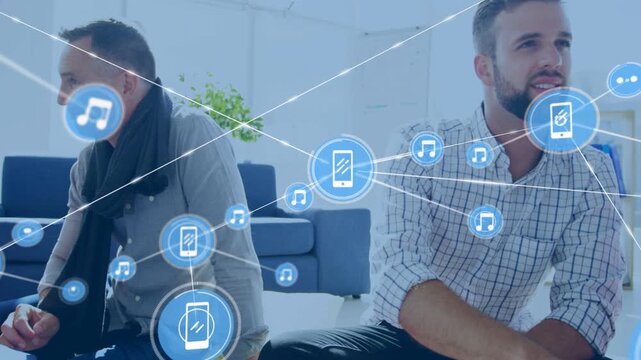 Team on floor reading folder, woman pointing causing growing phone or music icons overlay for busine