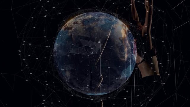 Performer on cue, climbing, inverting while globe data lines projecting around performer for tech