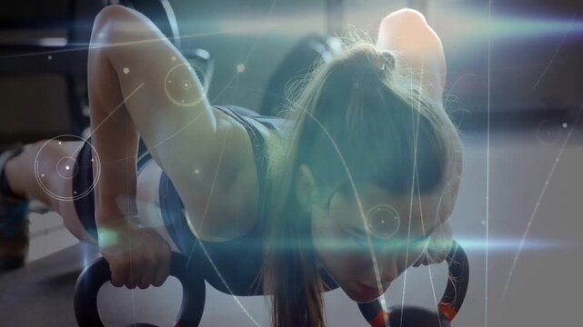 Woman gripping push-up handles, doing reps in gym while HUD and lens-flare sweeping, building power