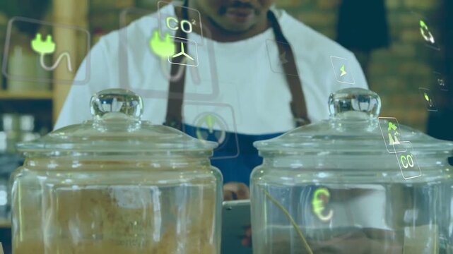 Barista using tablet and lifting jar lids, inspecting contents while sorting jars, icons floating