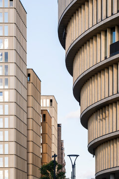 Urban Stockholm Hagastaden features modern architecture where a curved building facade and clean lines express calm minimalism in contemporary city design