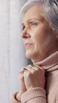 Sad, thinking and senior woman in home, anxiety and mourning for grief, remember or contemplation. Reflection, stress and person with depression, mental health or retirement with emotion and wonder