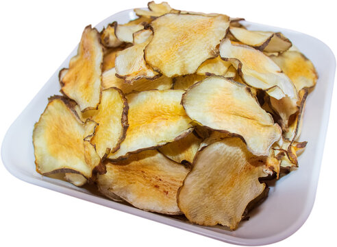 Organic Jerusalem artichoke chips in white dish isolated on transparent background, PNG