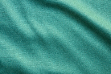 Fototapeta premium Green sports clothing fabric football shirt jersey texture close up
