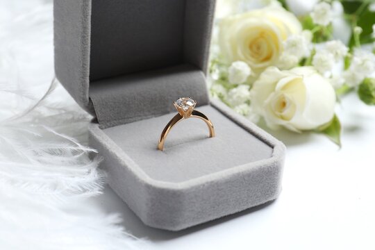 Elegant wedding ring in a velvet box, luxurious accessory with soft lighting and romantic mood