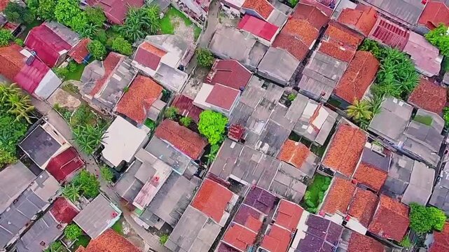 Aerial Drone Rising Shot of Dense Residential Area in Indonesia with Compact Housing and Urban Neighborhood
