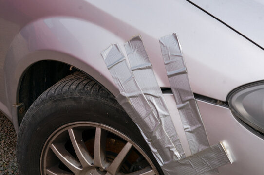 The fenders of the car were taped with duct tape