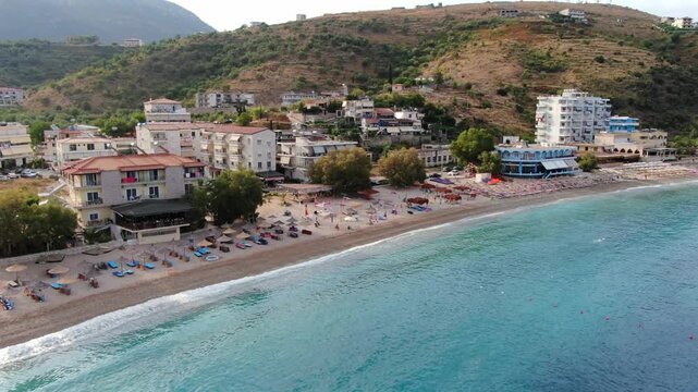 Picturesque seaside town of Himare in Albania. Aerial view of the beautiful turquoise water of the Ionian sea and the scenic coastline
