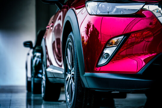New luxury SUV compact car parked in modern showroom for sale. Car dealership office. Car retail shop. Electric car technology and business concept. Automobile rental concept.
