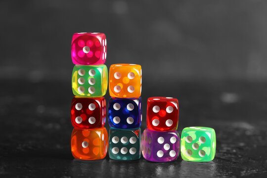Colorful game dices on black background