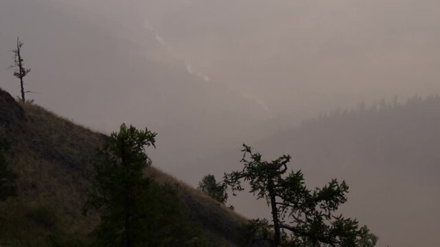 Southern Urals, Southern Kraka mountain range in summer: mountains in the dawn haze.