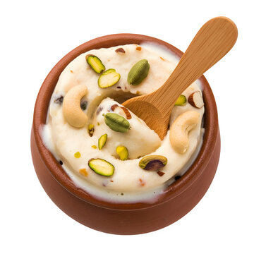 Traditional Indian Kulfi ice cream in clay pot, frozen dairy dessert with pistachios and cashews, creamy malai kulfi with wooden spoon on white background