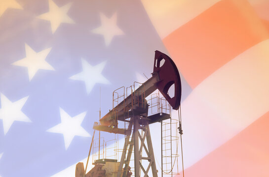 Pumpjack in oil well of oil field on United States flag background. Crude pump jack oil field. US energy industry, oil production and export. US oil industry. Oil industry USA energy policy.