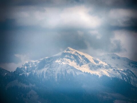 snow-capped peak in the Himalayas, specifically identifying as Ganga Choti in the Bagh District of Azad Kashmir, Pakistan