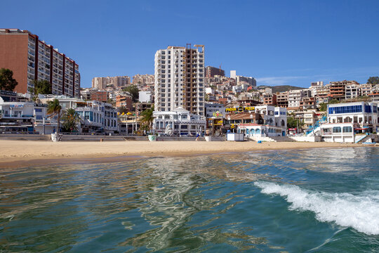 Panorama of city of Annaba - view from Mediterranean Sea. Beach and modern houses on shore of the bay