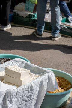 Fresh white tofu blocks displayed on a cotton cloth at a traditional Korean market