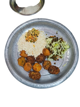 Traditional nepali dal bhat tarkari on metal plate isolated on a transparent background traditional nepali food