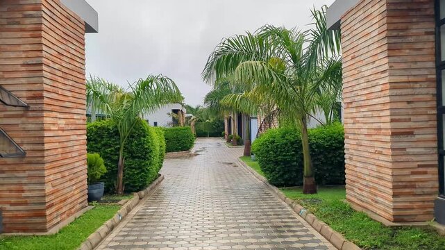 Video of a modern exterior of a minimalistic apartment in a residential complex, featuring a clean and simple design with direct outdoor access.