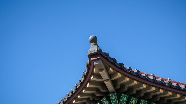 dancheong. Temple roof corner with colorful dancheong paintings against a blue sky. event programs, museum guides, designed for cultural heritage projects and event programs, preserves heritage.