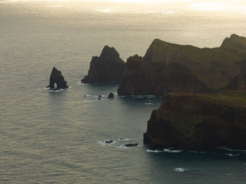 Aerial view of Ponta de Sao Lourenco with dramatic volcanic cliffs and sea stacks rising from the Atlantic Ocean in Canical, Madeira, Portugal.
