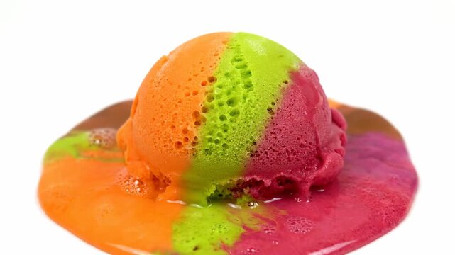 Colorful Rainbow Ice Cream Scoop Melting on White Background Vibrant Summer Dessert Time Lapse
