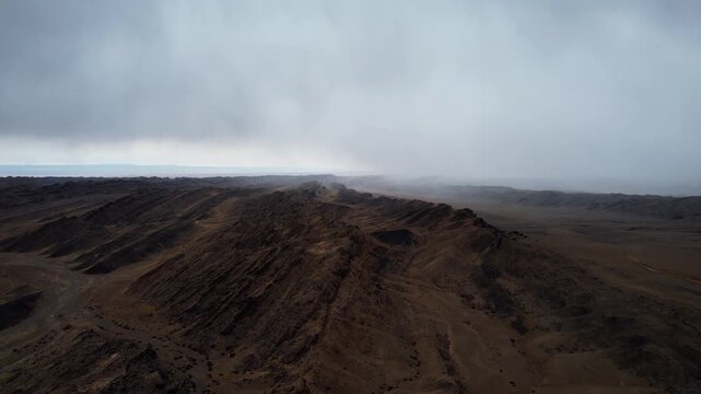 Drone Shot Of Layered Strata In Harsh Desert Light, Noyon Uul, Mongolia