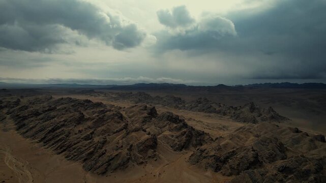 Moody Drone Shot Of Folded Strata In Arid Terrain, Noyon Uul, Mongolia