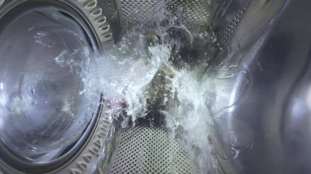 Washing Machine Process with Water Splashing, View from Inside Drum