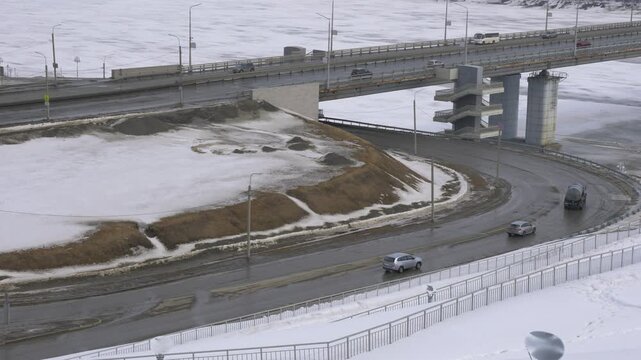 March 22 2026 Barnaul Russia new bridge over Ob River connecting Central District and right bank covered in snow cold early spring cityscape urban infrastructure and winter atmosphere.