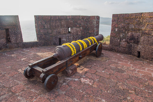 Ancient cannon at Bankot Fort or Himmatgad Fort or Fort Victoria, Velas, Maharashtra, India.