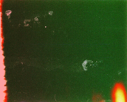 Blank grained film strip texture background with heavy grain, dust and light leak
