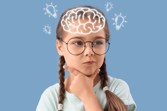 Thoughtful little girl on blue background