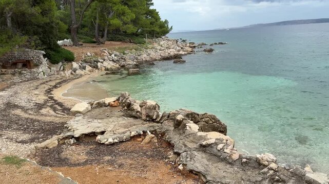 Tropical beach with turquoise water and lush greenery on Rab Island Croatia
